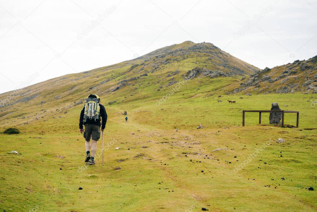 Lone pilgrim walking the Camino de Santiago through the Pyrenees. France - nov, 2021. High quality photo