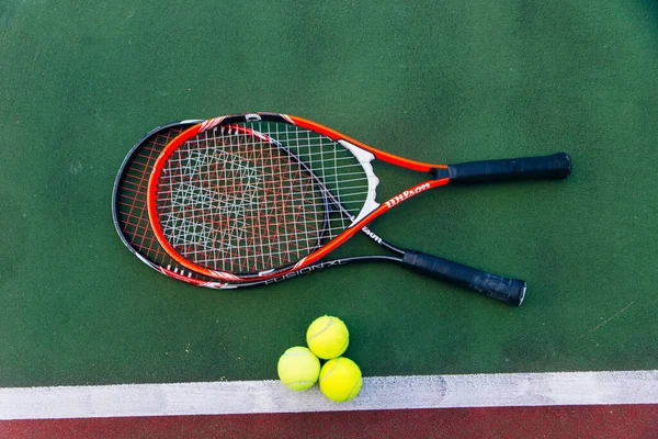 Sport. Close up picture of racket and tennis ball on court. Sport, healthy and lifestyle concept. High quality photo