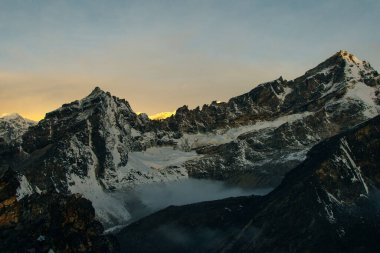 Fire on Everest. Everest mountain on sunrise, view from Gokyo Ri peak. Himalayas, Nepal. High quality photo clipart
