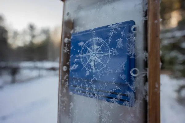 Beautiful compass directions wind rose made from frozen glass. High quality photo
