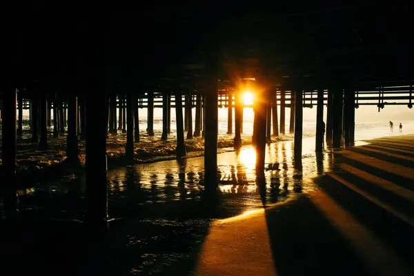 people near Santa Monica pier at sunset, Los Angeles, usa - Apr, 2022. High quality photo