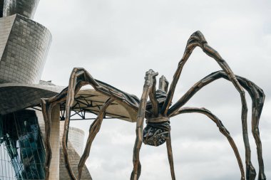 BILBAO, SPAIN - nov, 2021 The Spider, sculpture of Louise Bourgeois in the Guggenheim Museum Bilbao, Spain. High quality photo clipart