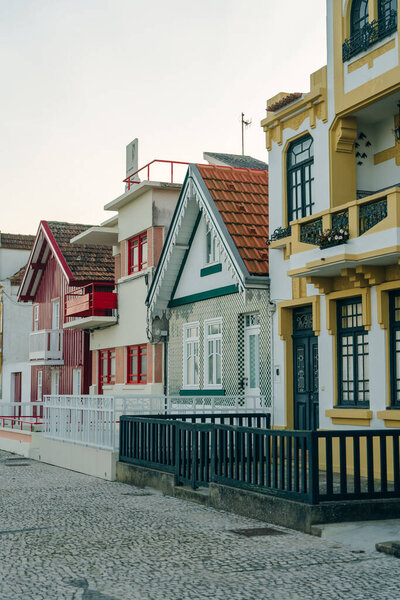 Street with colorful houses in Costa Nova, Aveiro, Portugal - november, 2021. High quality photo