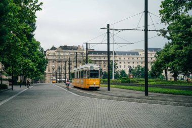 yellow tram in budapest city, hulgary - nov, 2021. High quality photo clipart