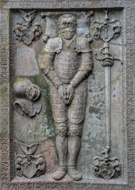 Ancient medieval marble tombstone of a knight