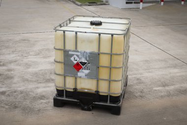 Warning symbol for chemical hazard on chemical container, chemical in factory 