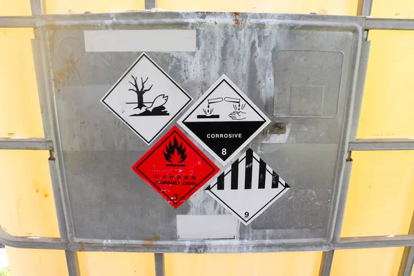 Warning symbol for chemical hazard on chemical container, chemical in factory