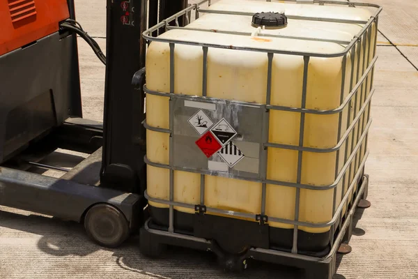 Warning symbol for chemical hazard on chemical container, chemical in factory