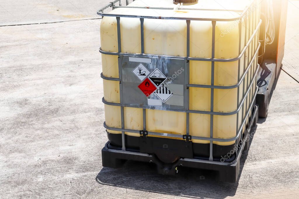 Warning symbol for chemical hazard on chemical container, chemical in factory 
