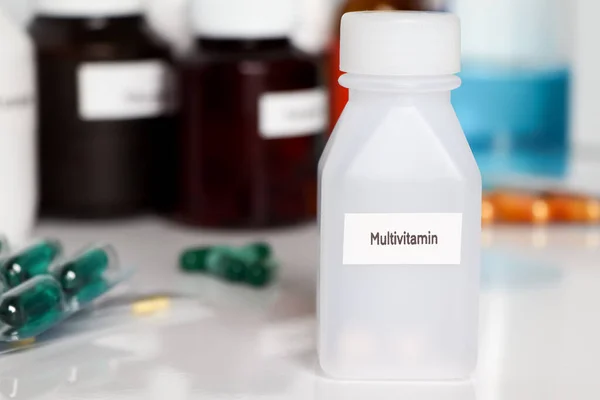Multivitamin in bottle ,medicines are used to treat sick people.