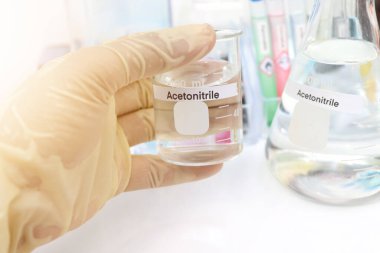 acetonitrile in glass, chemical in the laboratory and industry