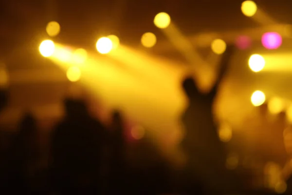 Shadows of people in a music Club and lights, Blurred image at night