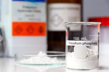 trisodium phosphate powder in glass, chemical in the laboratory and industry