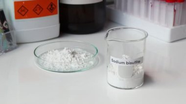 sodium bisulfite powder in glass, chemical in the laboratory and industry