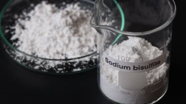sodium bisulfite powder in glass, chemical in the laboratory and industry