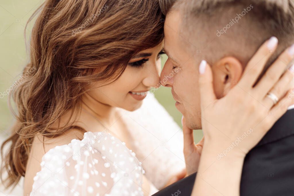 Portrait of happy wedding day. romantic gentle touch, concept of love and happy marriage. touching attitude of young couple. Side view. portrait of bride and groom. Life style, photo.