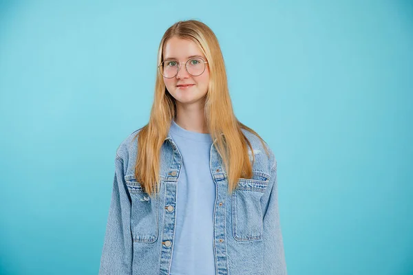 Young Positive Calm Blonde Woman Teenager Look Camera Eyeglasses Jeans — Zdjęcie stockowe
