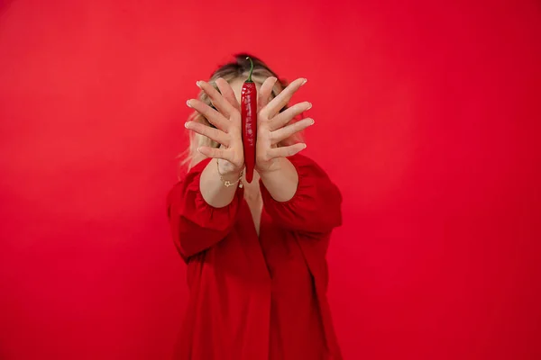 Unrecognizable Woman Red Outfit Holding Covering Face Chili Pepper Outstretched — ストック写真