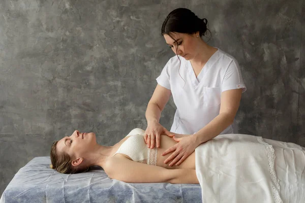 Serious Female Osteopath Doctor Doing Belly Chest Massage Fix Patient — Stok fotoğraf
