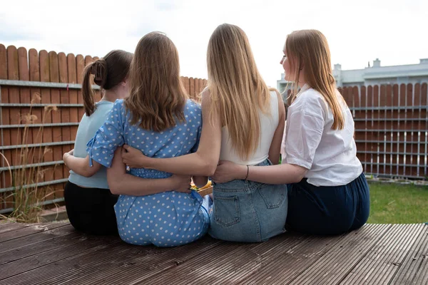 Back View Group Young Women Long Hair Sitting Wooden Veranda — 스톡 사진