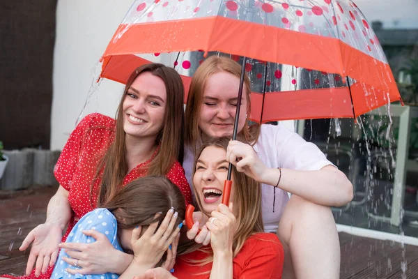 Group Young Laughing Stunning Women Sitting Wooden Veranda Hiding Rain — 图库照片
