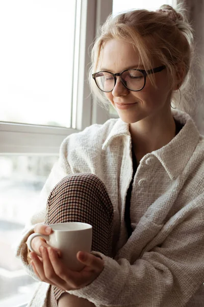Vertical Modern Pensive Smiling Blond Woman Eyeglasses Warm Clothes Sit — Stock Photo, Image