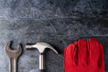 red welder gloves on a concrete background. the equipment of the worker. carpenter's tools