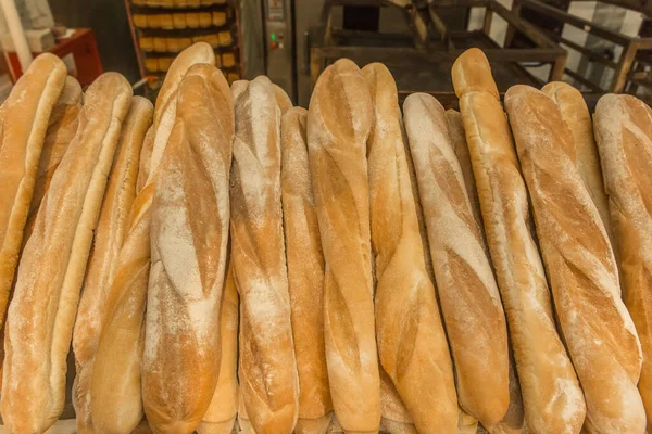 Fresh baked goods bakery loaf baguette bread background.