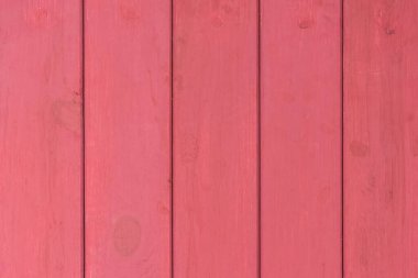 Dikey tahta tahtalar kırmızı boya yüzey dokusu arka planında boyanmış.