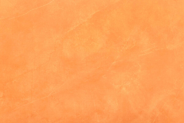 Orange plaster wall texture with abstract pattern stucco grunge surface background.