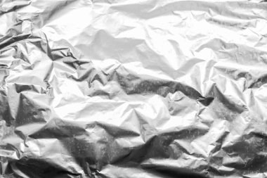 Folyo buruşmuş doku, gümüş maddeyi soyut model yüzey arkaplanına sıkıştırdı.