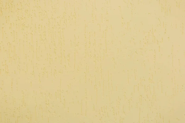 抽象的なスタッコパターンデザインのテクスチャの背景とプラスチック壁表面上の薄い柔らかい黄色の塗料の色 — ストック写真