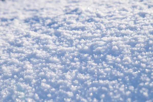 Snow povrch textury v světle modrém tónu. Zimní sezóna pozadí. — Stock fotografie