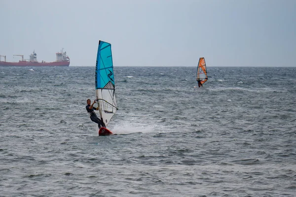 Orange Blue Windsurfing Riding Waves Choppy Sea Big Boat Background — Stock Photo, Image