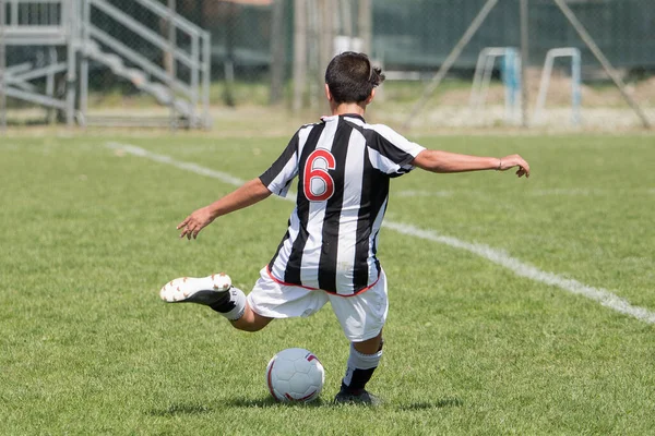 Boy Soccer Player Seen Black White Striped Jersey Kicking Ball — ストック写真