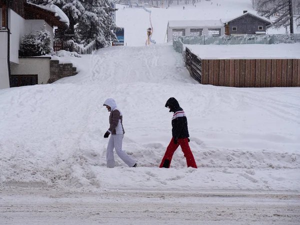 Two People Ski Suit Hood Heads Walking Cold Snowy Day — Stock Fotó