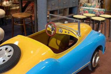 Antique Blue and Yellow Pedal Car Toy Model for Children.