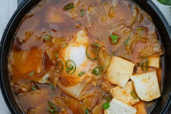 Korean spicy silken tofu stew which is called Sundubu Jjigae. Popular food in Korean Drama
