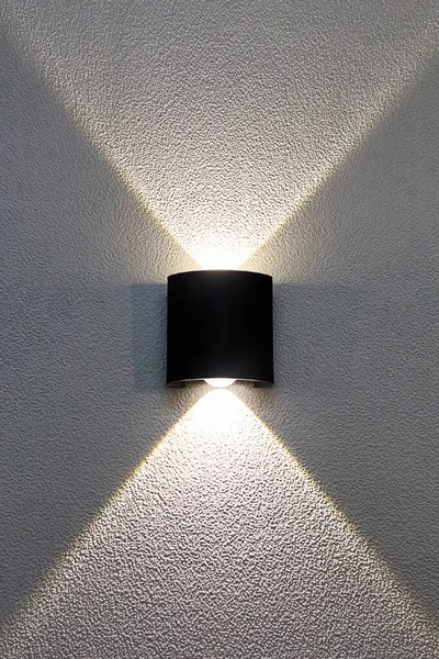 decorative LED wall lamp casting light on the wall