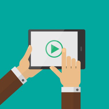 Watching video on tablet. Play button.