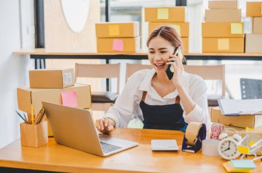 Small business owners online are chatting, selling products and checking orders for products that customers order. of online retailers - online shopping