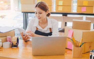 Small business owners online are chatting, selling products and checking orders for products that customers order. of online retailers - online shopping