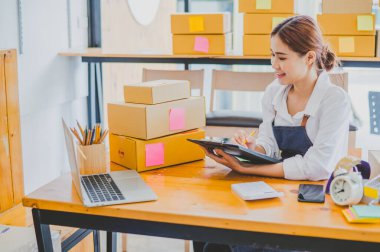 Small business owners online are checking their orders. where customers place orders and check the orders that the customers have ordered of online retailers - online shopping