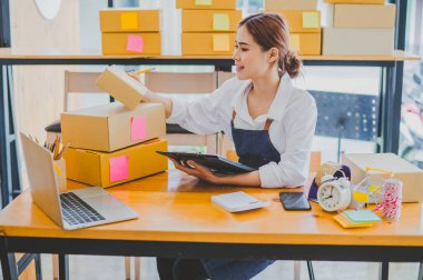 Small business owners online are checking their orders. where customers place orders and check the orders that the customers have ordered of online retailers - online shopping
