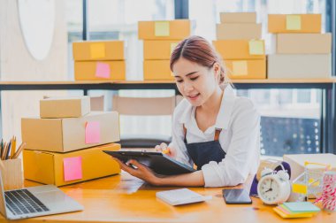 Small business owners online are checking their orders. where customers place orders and check the orders that the customers have ordered of online retailers - online shopping