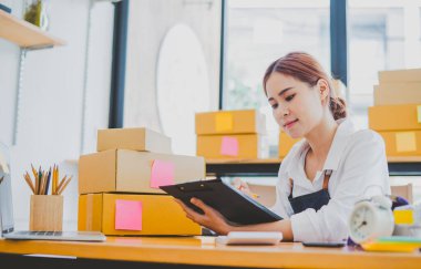 Small business owners online are checking their orders. where customers place orders and check the orders that the customers have ordered of online retailers - online shopping