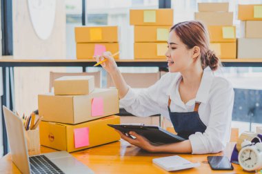 Small business owners online are checking their orders. where customers place orders and check the orders that the customers have ordered of online retailers - online shopping