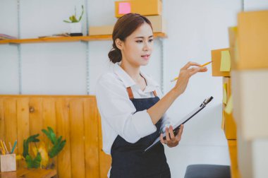 Small business owners online are checking their orders. where customers place orders and check the orders that the customers have ordered of online retailers - online shopping