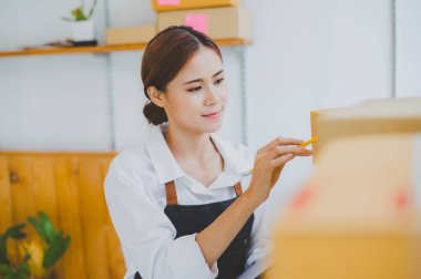 Small business owners online are checking their orders. where customers place orders and check the orders that the customers have ordered of online retailers - online shopping