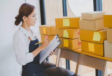 Small business owners online are checking their orders. where customers place orders and check the orders that the customers have ordered of online retailers - online shopping